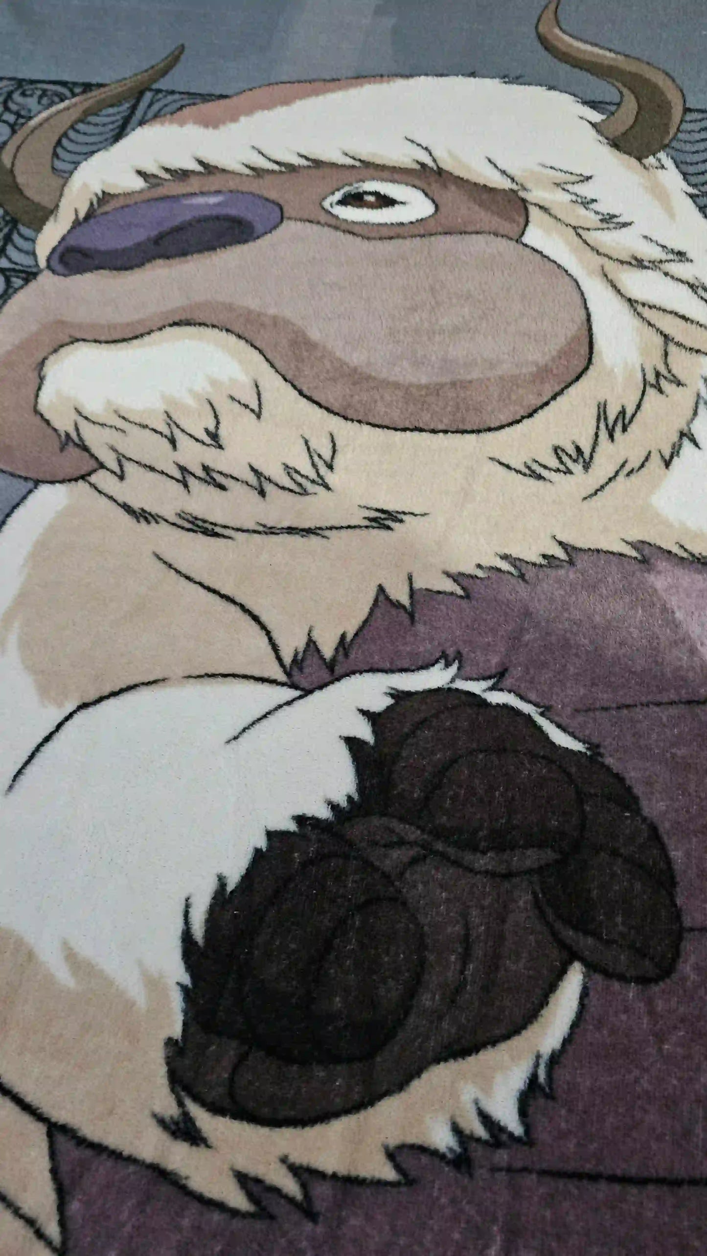 Primer plano del diseño de Appa en la cobija de Avatar The Last Airbender mostrando textura